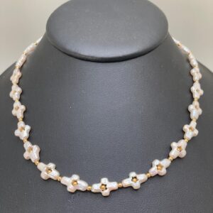 Cross-shaped Pearl necklace and earring set.