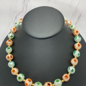 Double drilled Star holes in neon green and dyed orange pearls.