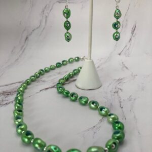 Ultrasonically drilled green pearls with internal beads (set)